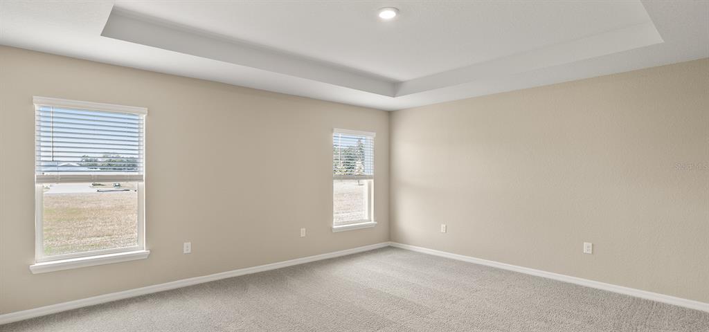 7654 Southwest 6th Loop Ocala, FL 34474 - Photo 22 of 28 an empty room with windows