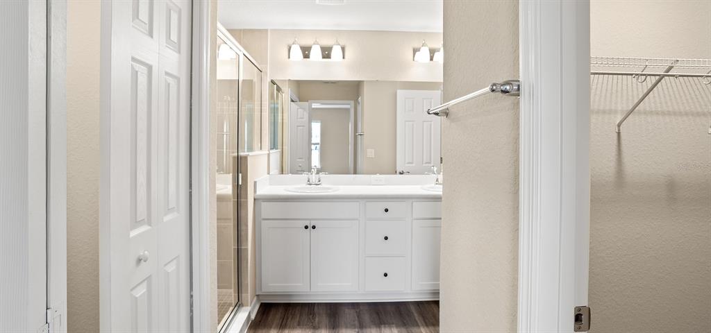7654 Southwest 6th Loop Ocala, FL 34474 - Photo 26 of 28 a bathroom with a sink and a mirror