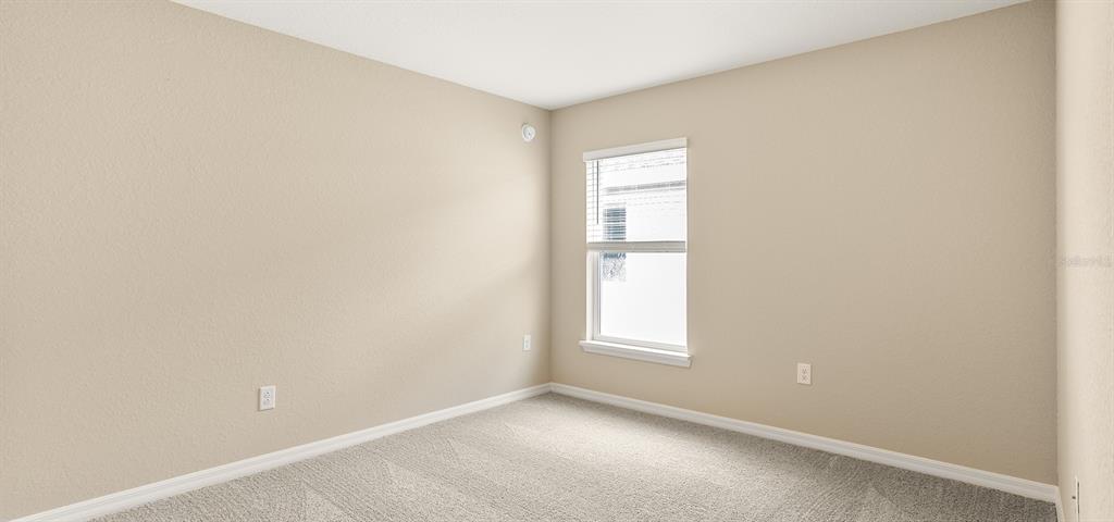7654 Southwest 6th Loop Ocala, FL 34474 - Photo 6 of 28 an empty room with windows