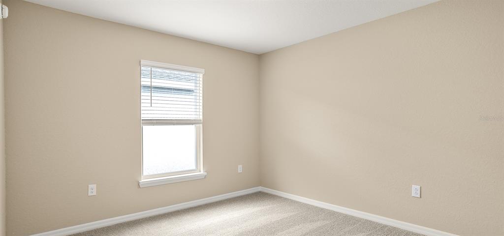 7654 Southwest 6th Loop Ocala, FL 34474 - Photo 7 of 28 an empty room with a window