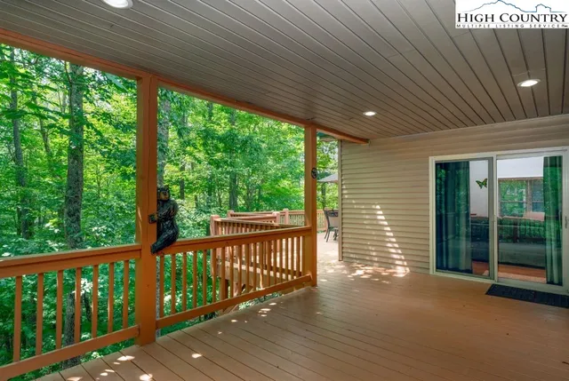 a view of a deck with wooden floor and outdoor space