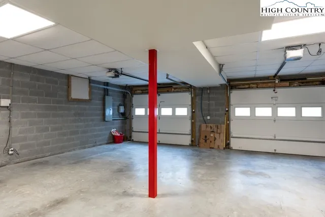 a view of a chair and tables in the backyard