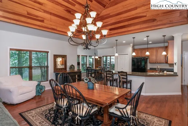 a kitchen with stainless steel appliances a stove sink and microwave