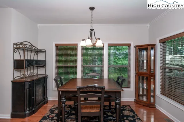 a view of a balcony with floor to ceiling windows