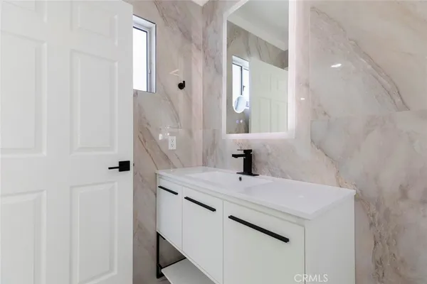 a bathroom with a sink and a mirror