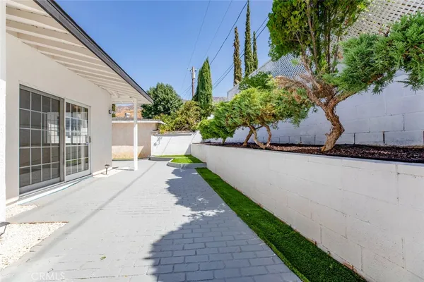 a front view of a house with a yard and a garage