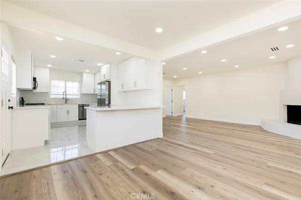a view of kitchen view wooden cabinets and kitchen view