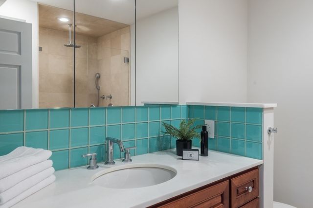 a view of a hallway with washer and dryer