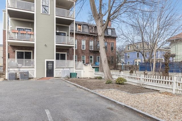 front view of a house with a garden