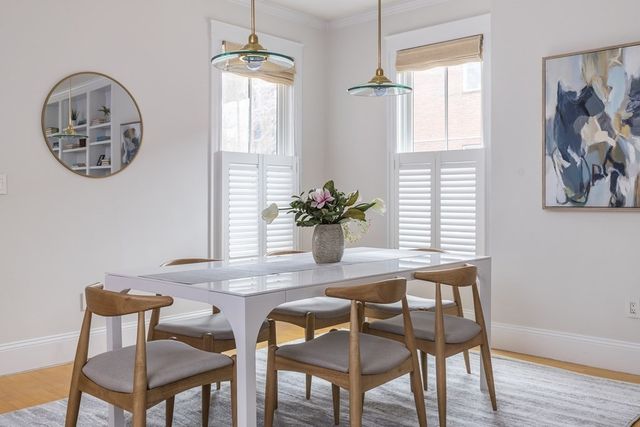 a dining room with furniture and window
