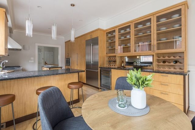 a dining room with furniture and wooden floor