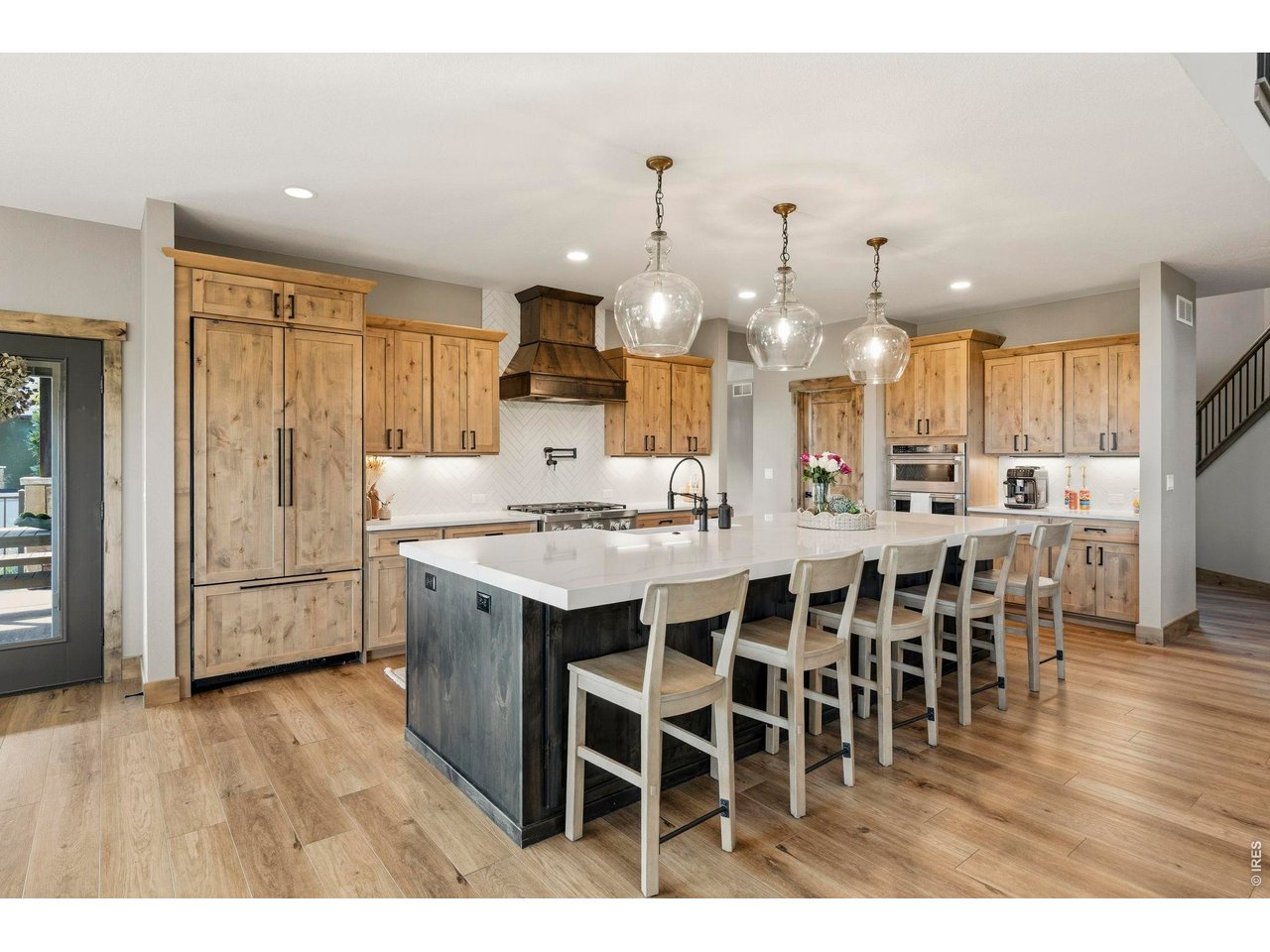 2734 Southwind Road Berthoud, CO 80513 - Photo 10 of 50 Oversized Island with contracting wood tone cabinets