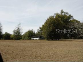 2160 Northeast 140th Street Citra, FL 32113 - Photo 1 of 1 a view of swimming pool with trees in the background