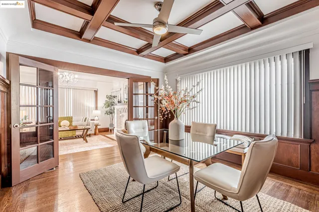 a dining room with furniture and wooden floor