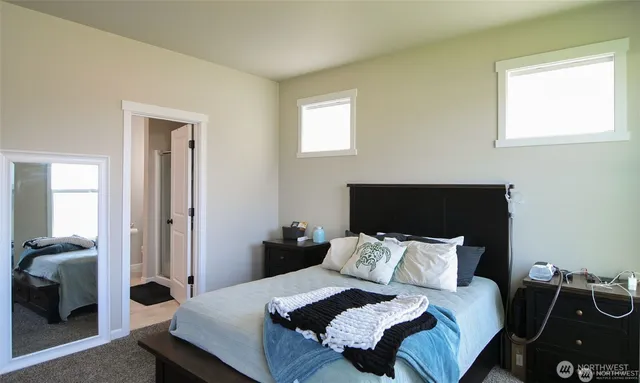 a bedroom with bed and window