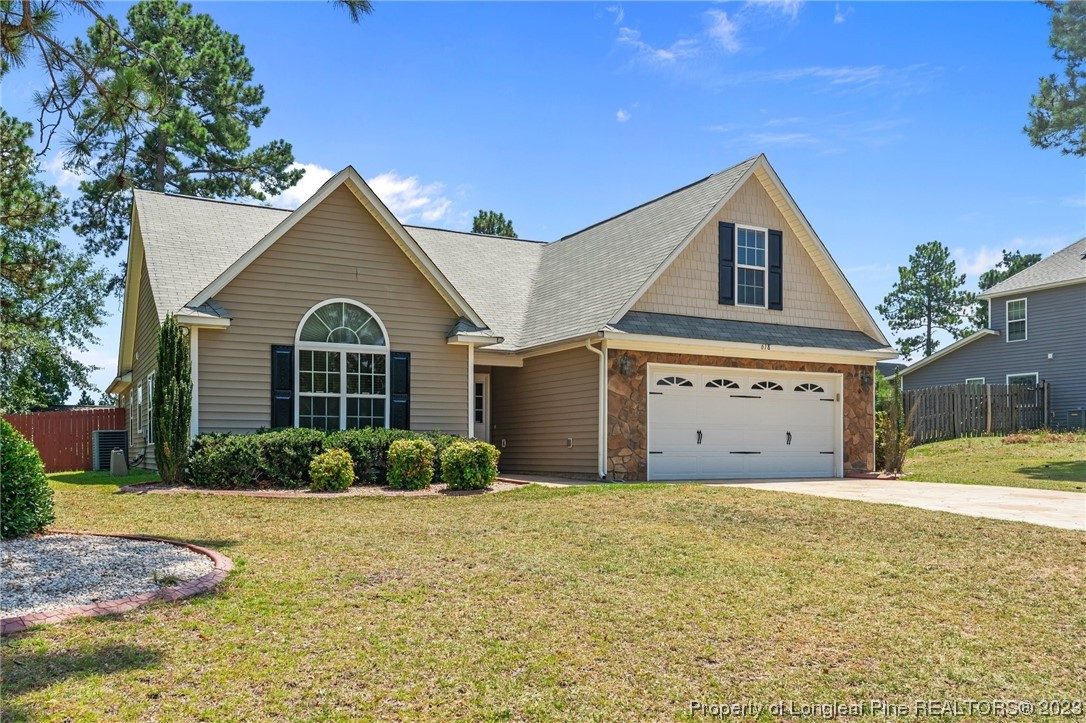 618 Valley Oak Drive Bunnlevel, NC 28323 - Photo 3 of 38 a view of a white house with a yard