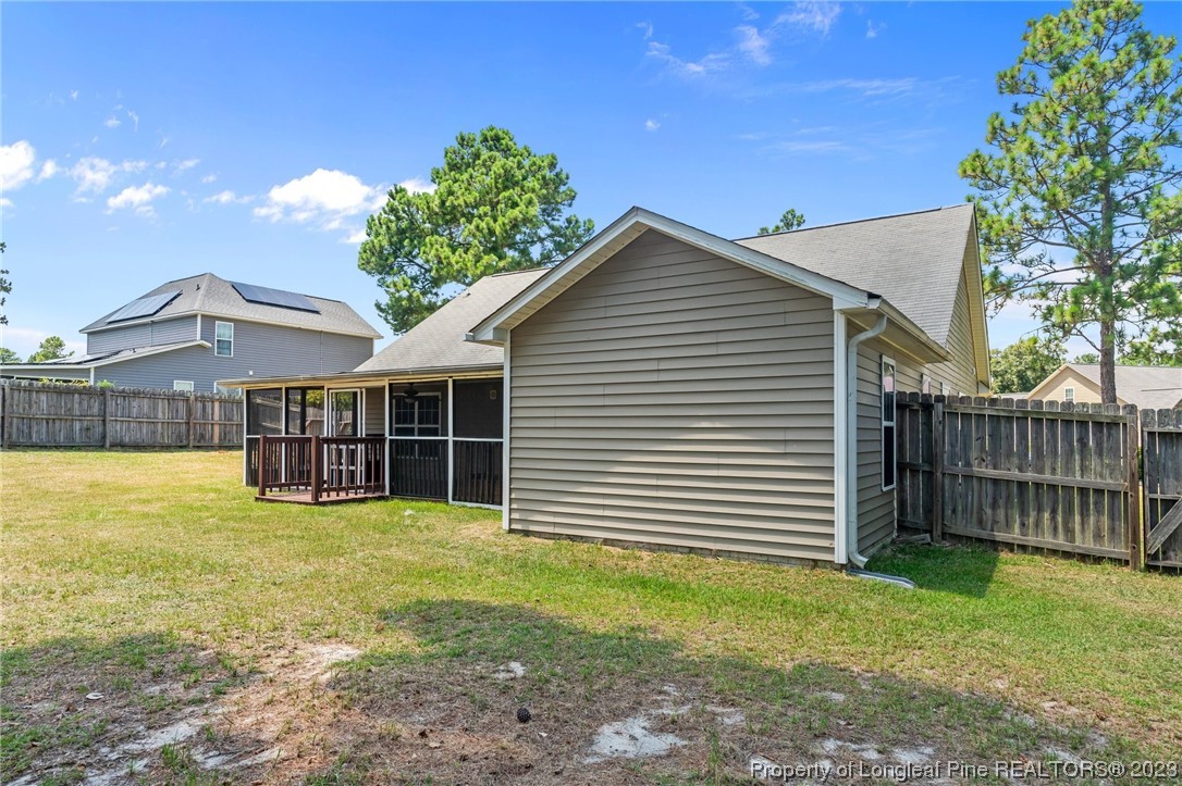 618 Valley Oak Drive Bunnlevel, NC 28323 - Photo 33 of 38 a view of a house with a yard and deck