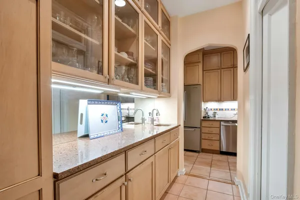 a kitchen with stainless steel appliances granite countertop a sink and cabinets