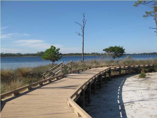 1105 Prospect Promenade, Unit 101 Panama City Beach, FL 32413 - Photo 13 of 27 a view of a lake with a ocean view