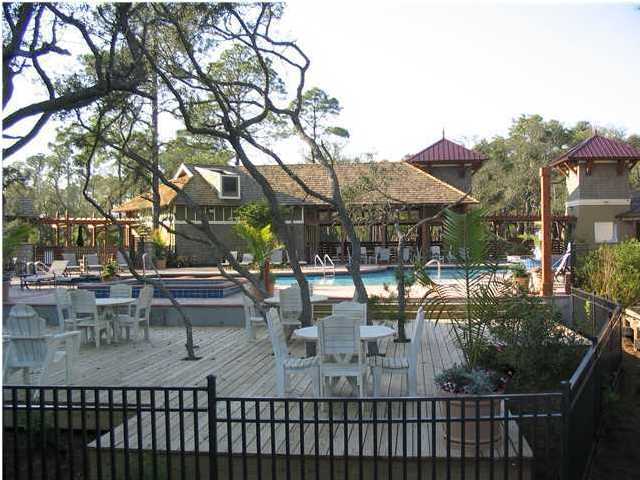 1105 Prospect Promenade, Unit 101 Panama City Beach, FL 32413 - Photo 16 of 27 a view of a chairs and table in the patio