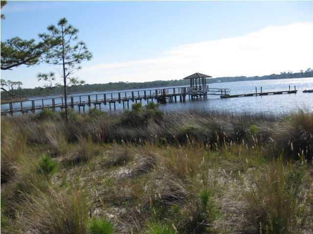 1105 Prospect Promenade, Unit 101 Panama City Beach, FL 32413 - Photo 18 of 27 a view of a lake and green valley