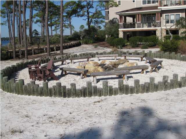 1105 Prospect Promenade, Unit 101 Panama City Beach, FL 32413 - Photo 20 of 27 a view of a lake with a house