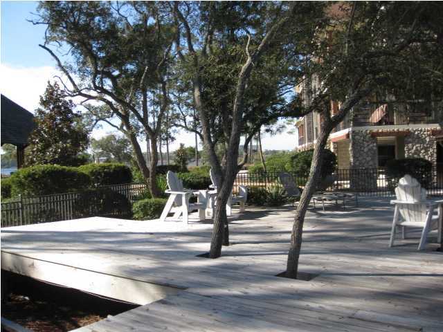1105 Prospect Promenade, Unit 101 Panama City Beach, FL 32413 - Photo 24 of 27 a view of fountain with wooden fence