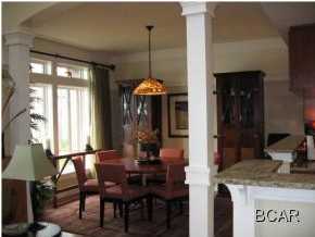 1105 Prospect Promenade, Unit 101 Panama City Beach, FL 32413 - Photo 3 of 27 a dining room with furniture and window