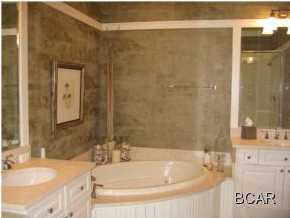 1105 Prospect Promenade, Unit 101 Panama City Beach, FL 32413 - Photo 7 of 27 a bath tub sitting next to a bathroom