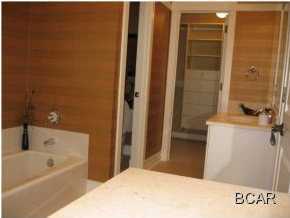 1105 Prospect Promenade, Unit 101 Panama City Beach, FL 32413 - Photo 9 of 27 a bathroom with a bathtub and a sink