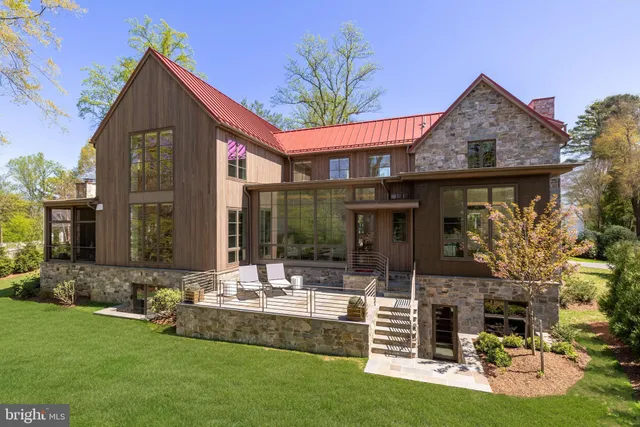 a front view of house with yard and outdoor seating