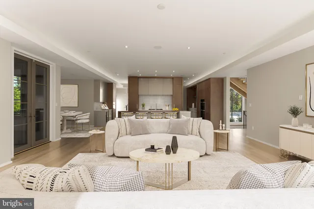 a large bedroom with a large bed and a couch