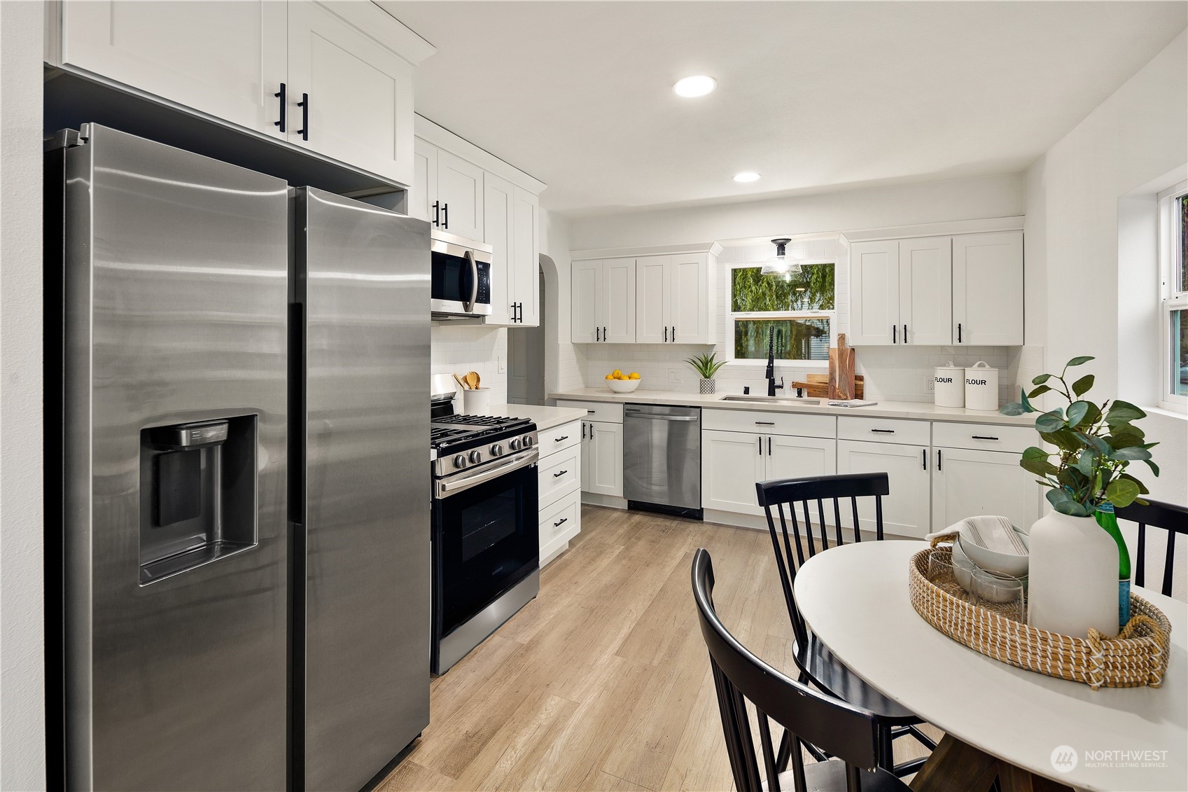 533 Wells Avenue South Renton, WA 98057 - Photo 8 of 32 a kitchen with a refrigerator and a sink