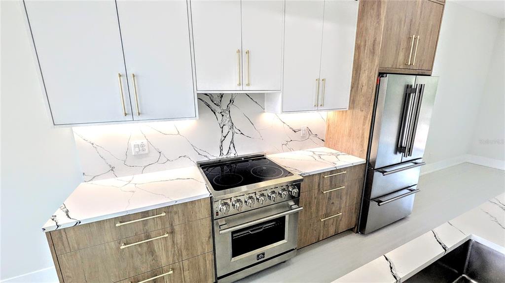 2194 Fruitville Road Sarasota, FL 34237 - Photo 11 of 32 a kitchen with a stove and a refrigerator