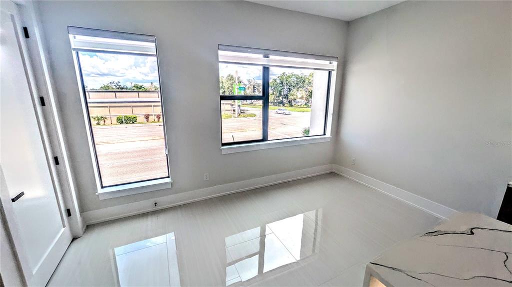 2194 Fruitville Road Sarasota, FL 34237 - Photo 15 of 32 a view of an empty room and a window