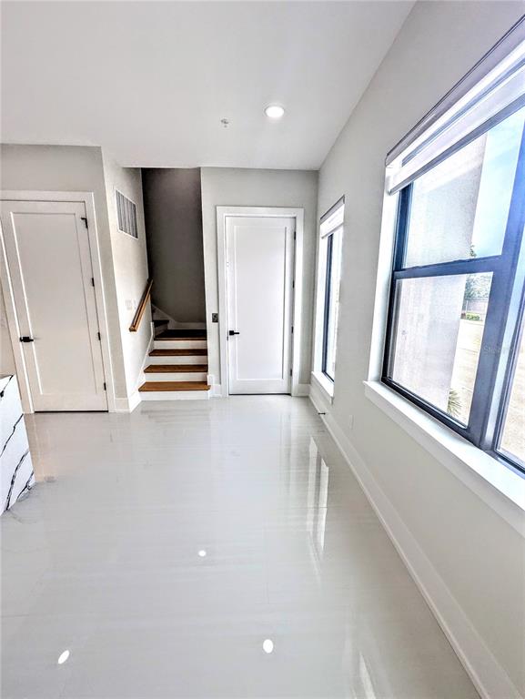 2194 Fruitville Road Sarasota, FL 34237 - Photo 17 of 32 wooden floor in an empty room with a window