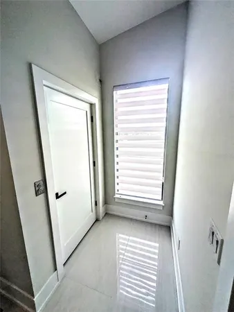 a view of a kitchen from the hallway