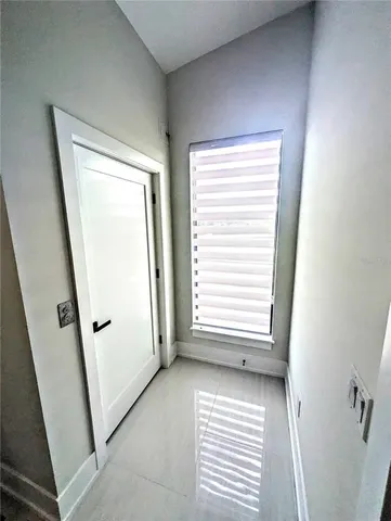 a view of a kitchen from the hallway