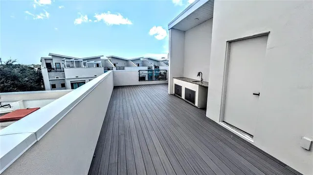 a view of living room kitchen and entryway