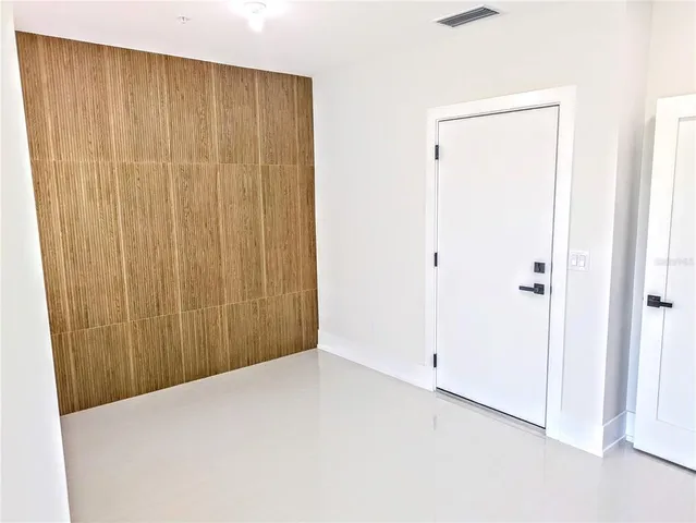 a view of a room with wooden walls