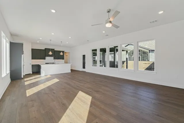 a view of kitchen with furniture and wooden floor