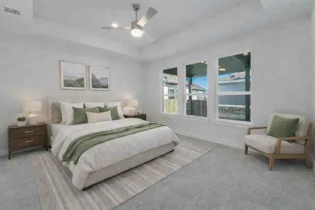 a spacious bedroom with a large bed and a window