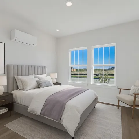 a bedroom with bed and a window