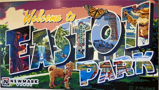 a room with gym equipment and large windows