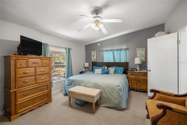 a bedroom with a bed and furniture