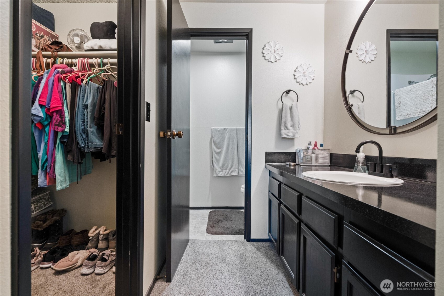 3560 Narrows View Lane Northeast, Unit 202 Bremerton, WA 98310 - Photo 22 of 27 a en suite bathroom with a sink and a mirror
