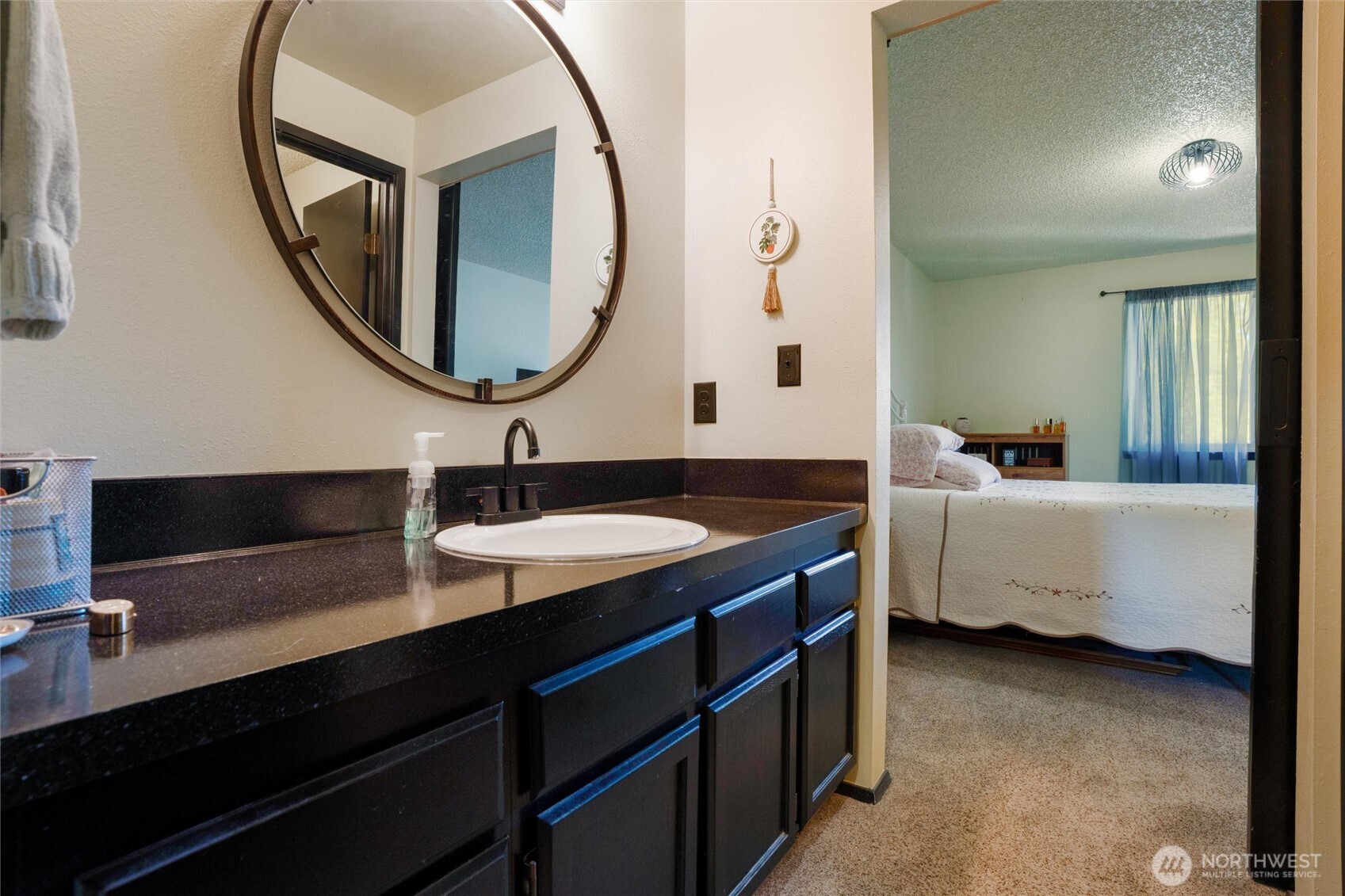 3560 Narrows View Lane Northeast, Unit 202 Bremerton, WA 98310 - Photo 24 of 27 a en suite bathroom with a double vanity sink and a mirror