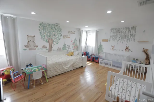 a spacious bedroom with a bed and a table