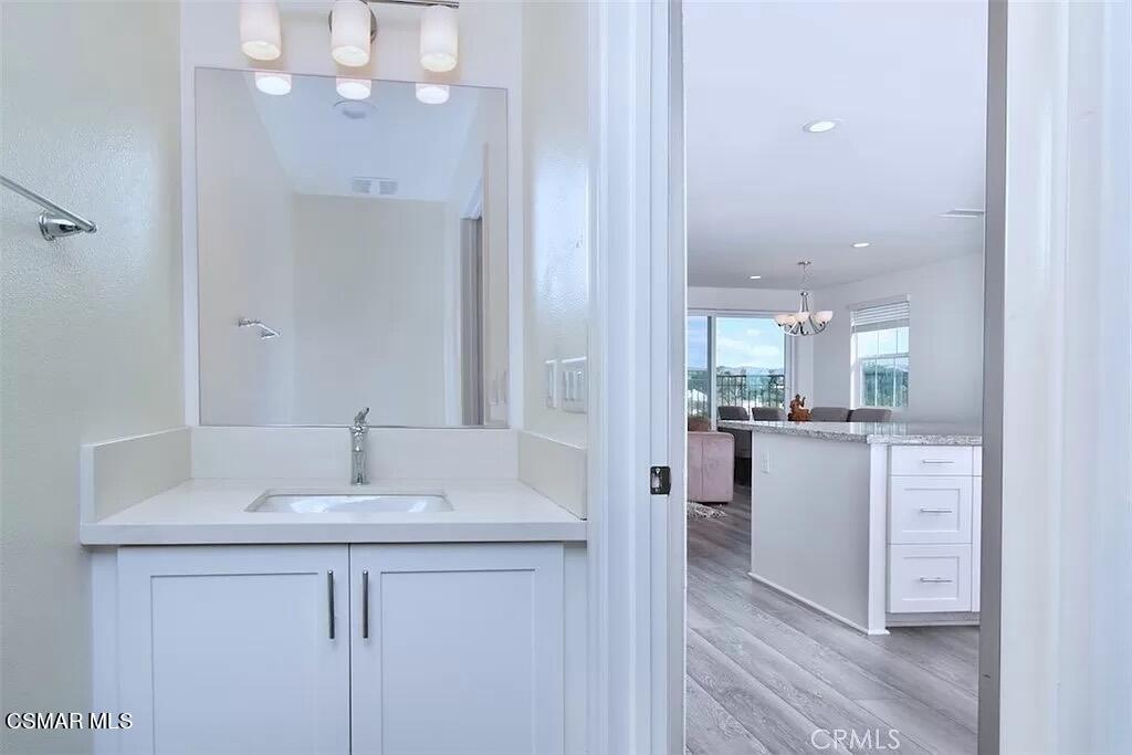 207 Morro Way, Unit 3 Simi Valley, CA 93065 - Photo 8 of 31 a bathroom with a sink vanity and mirror