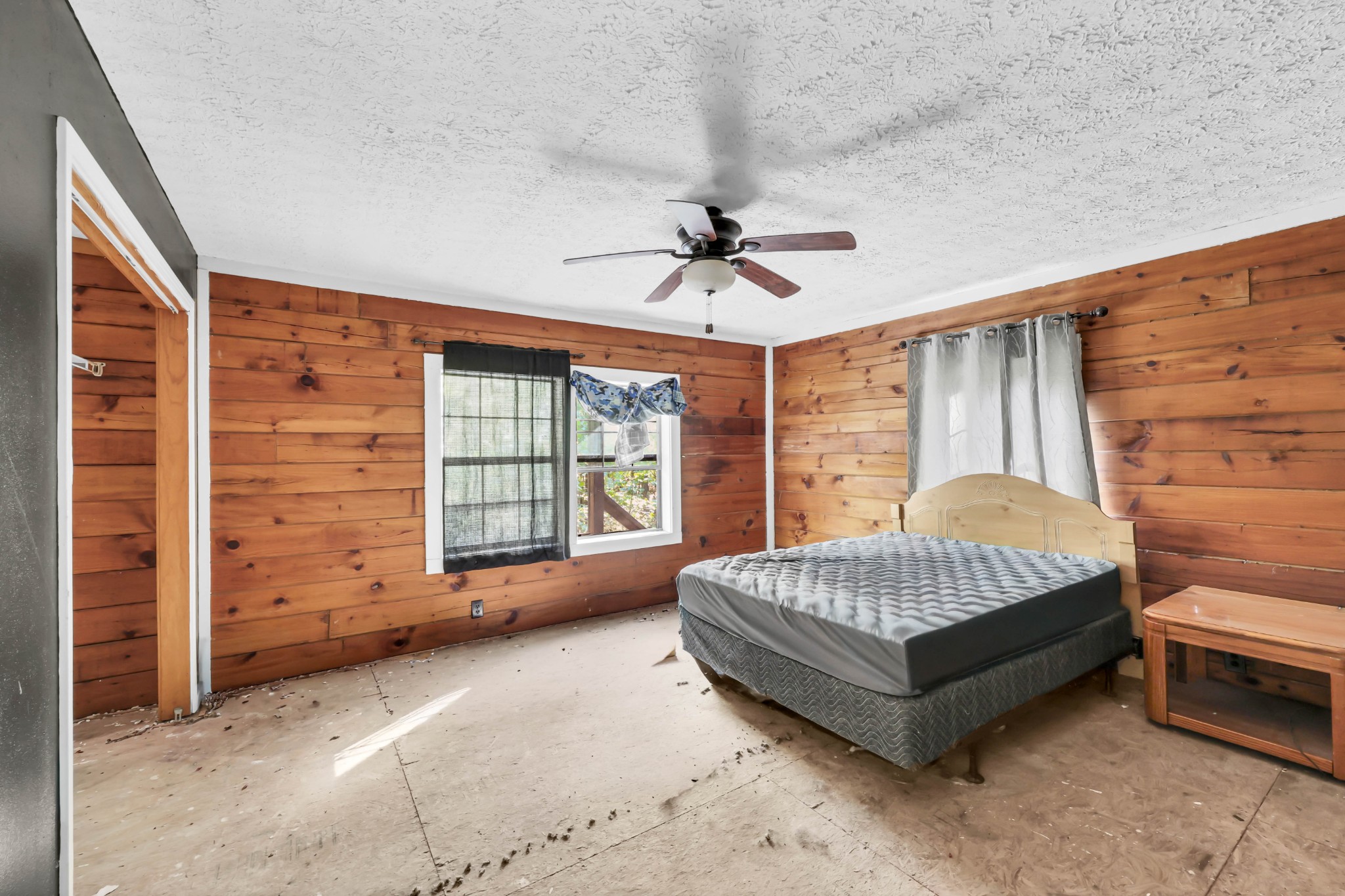 348 Shepherd Hollow Road Indian Mound, TN 37079 - Photo 20 of 23 a spacious bedroom with a bed and a chandelier